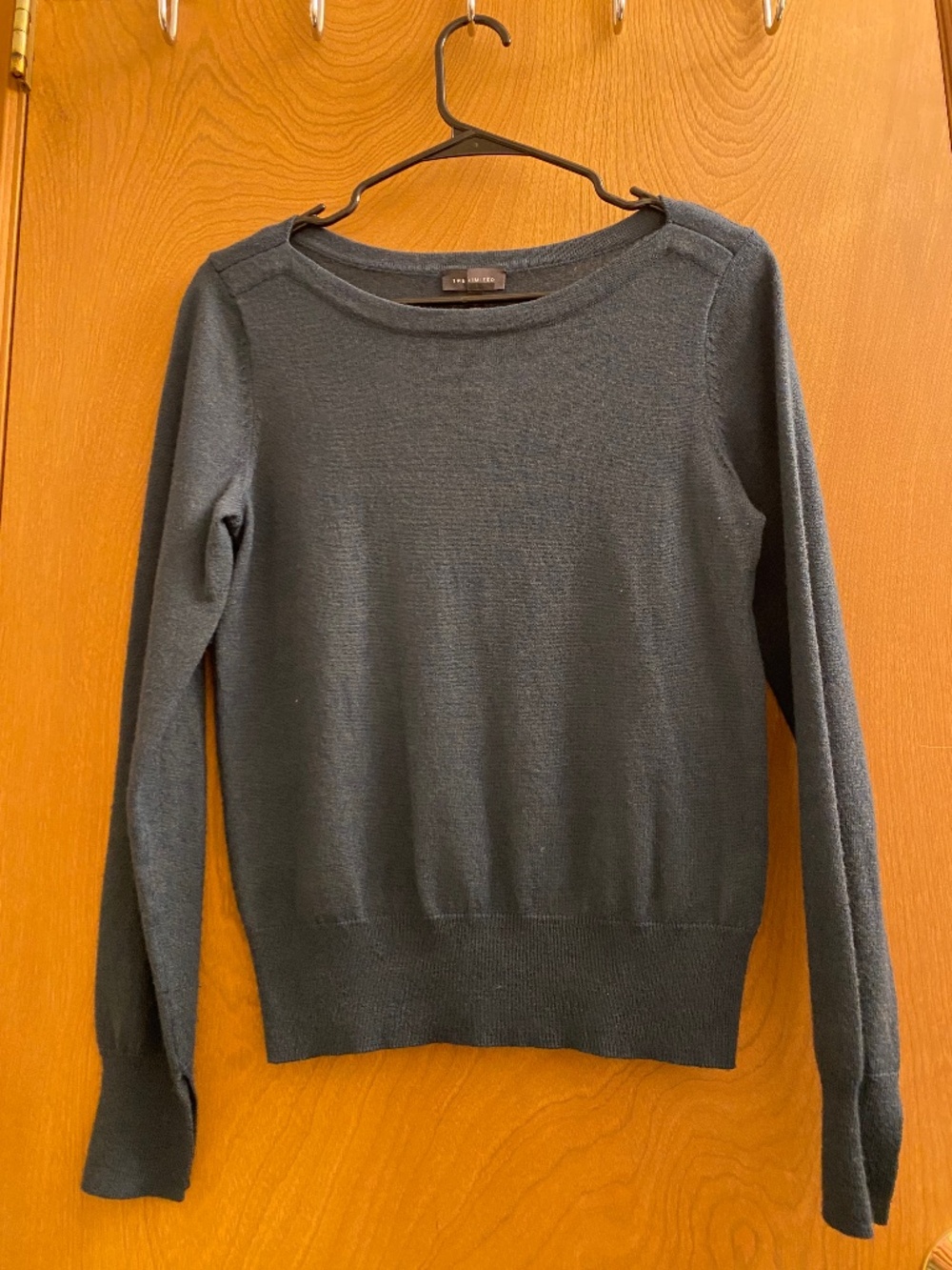 The limited women’s medium merino wool blend long sleeve shirt green